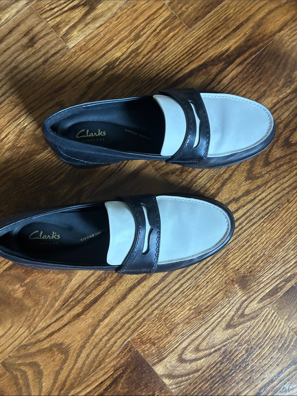 Clarks women’s Two-Tone Black and Cream Leather Penny Loafers